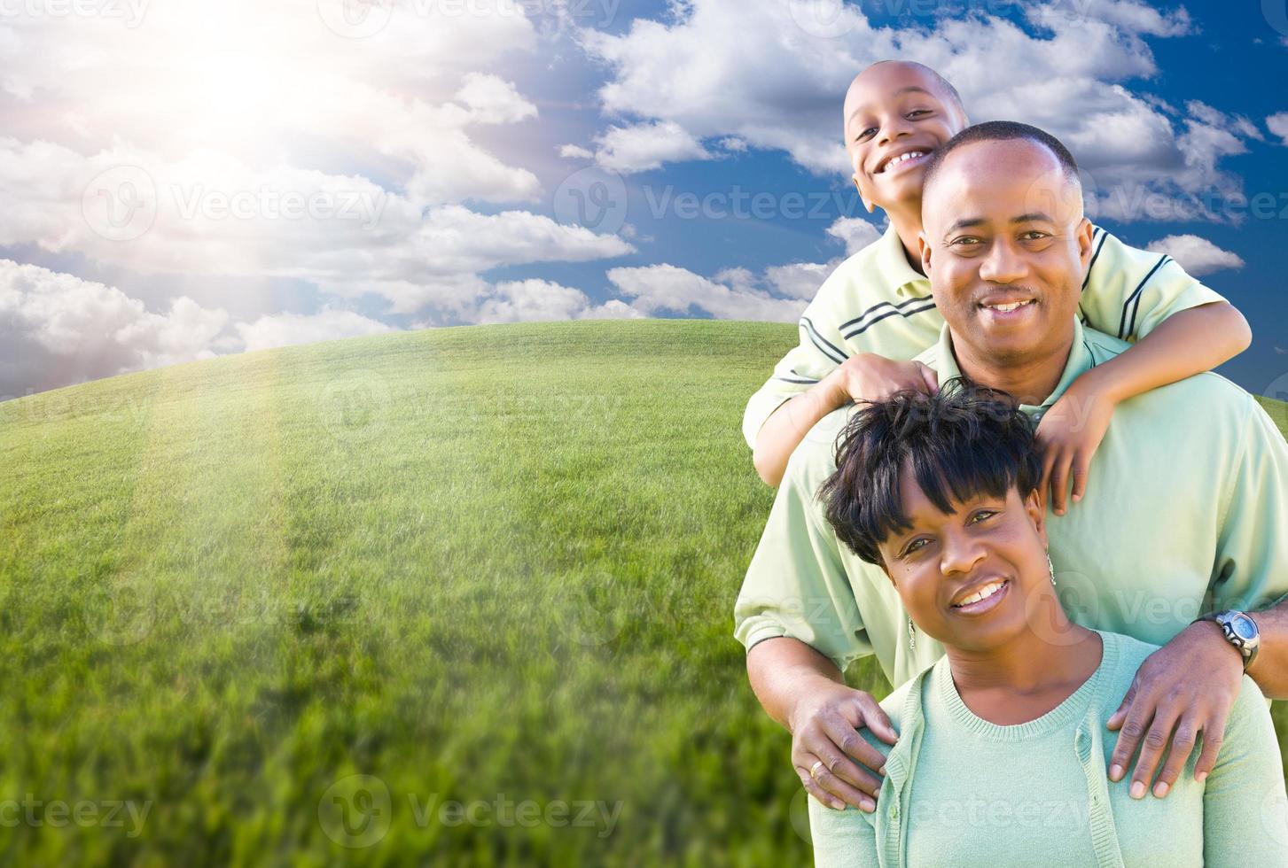 Family Over Clouds, Sky and Grass Field photo