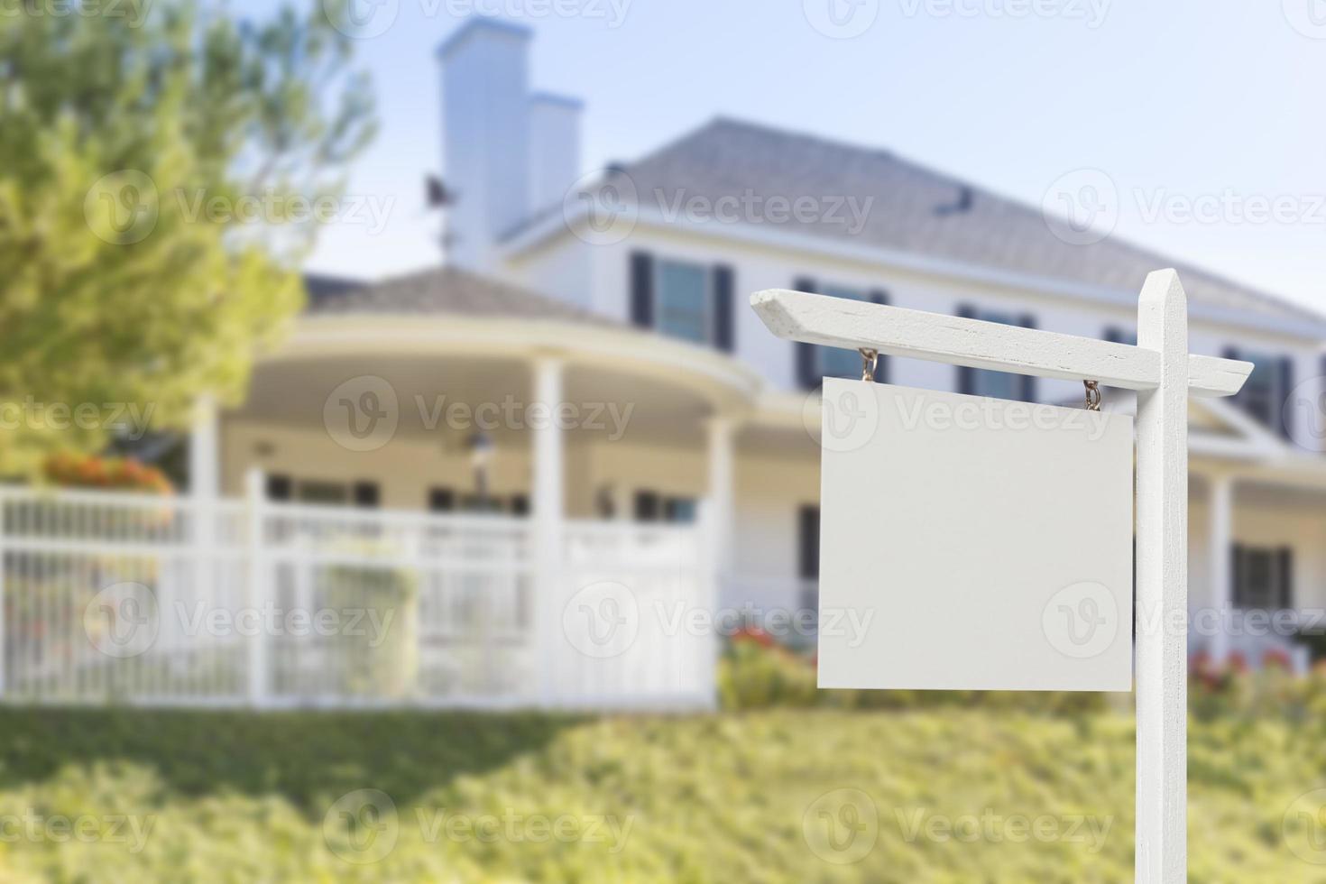 Blank Real Estate Sign in Front of New House photo