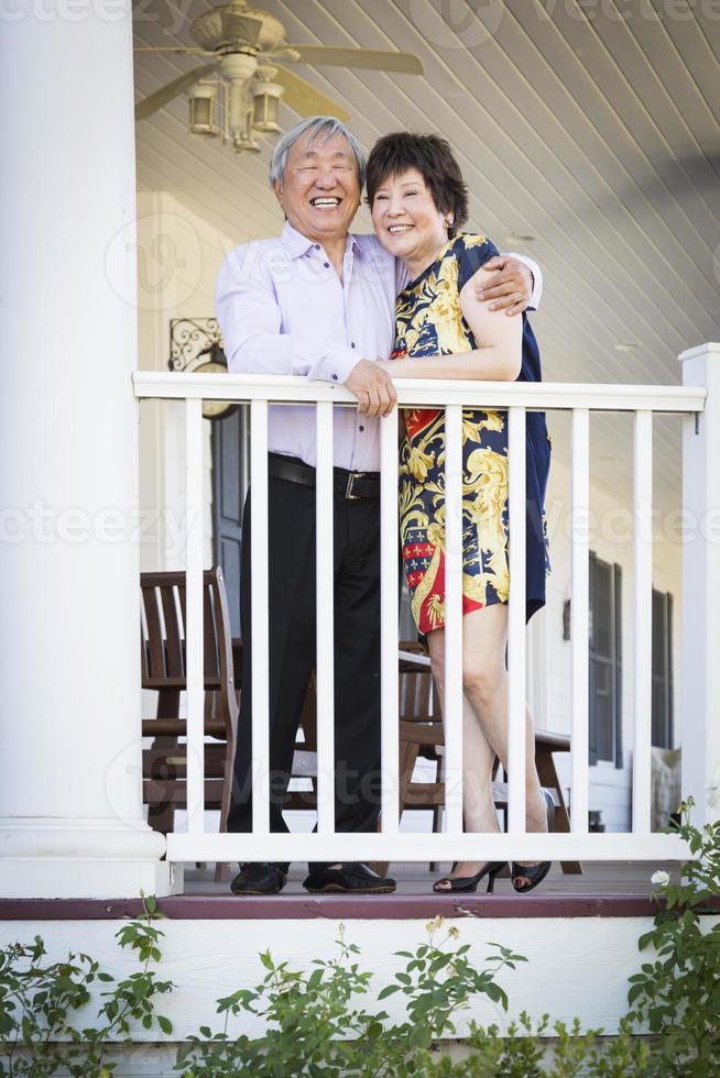 Attractive Chinese Couple Enjoying Their House photo