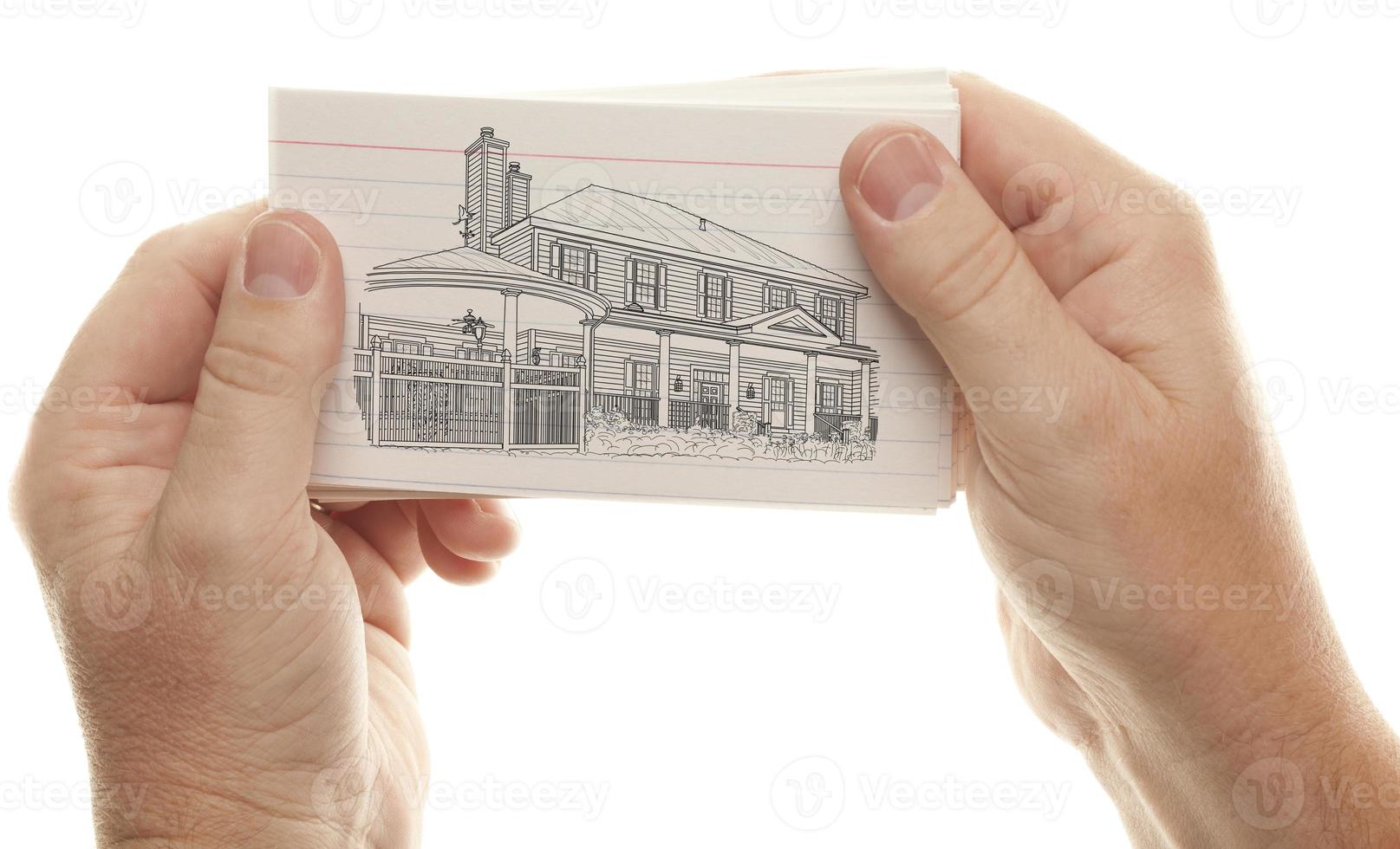 Male Hands Holding Stack of Flash Cards with House Drawing photo