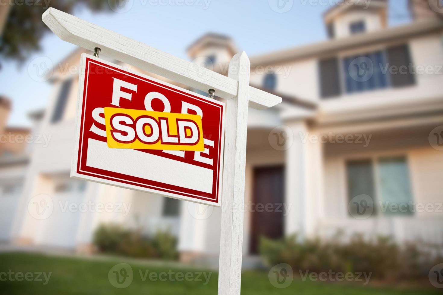 Home For Sale Real Estate Sign in Front of New House photo