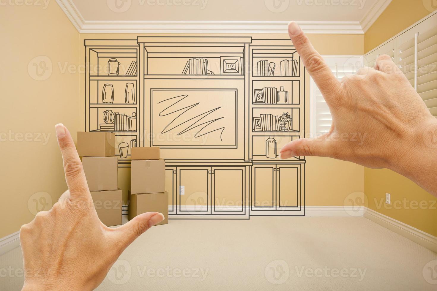 Hands Framing Drawing of Entertainment Unit In Empty Room photo