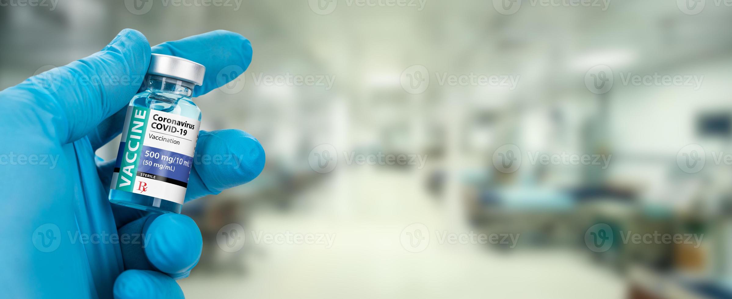 Doctor or Nurse Holding Coronavirus COVID-19 Vaccine Vial Within Hospital Banner. photo