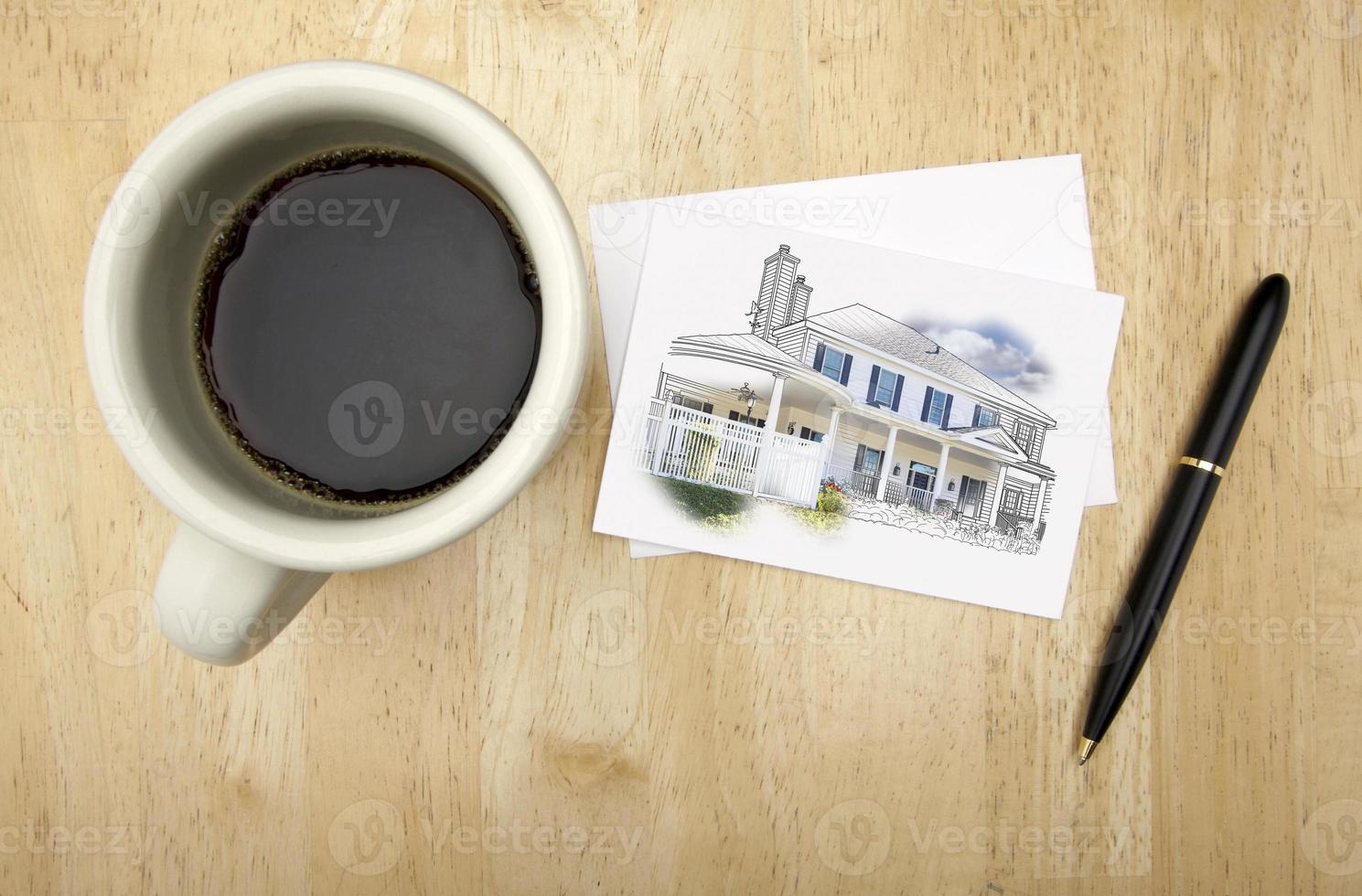 tarjeta de nota con dibujo de casa, pluma y café foto