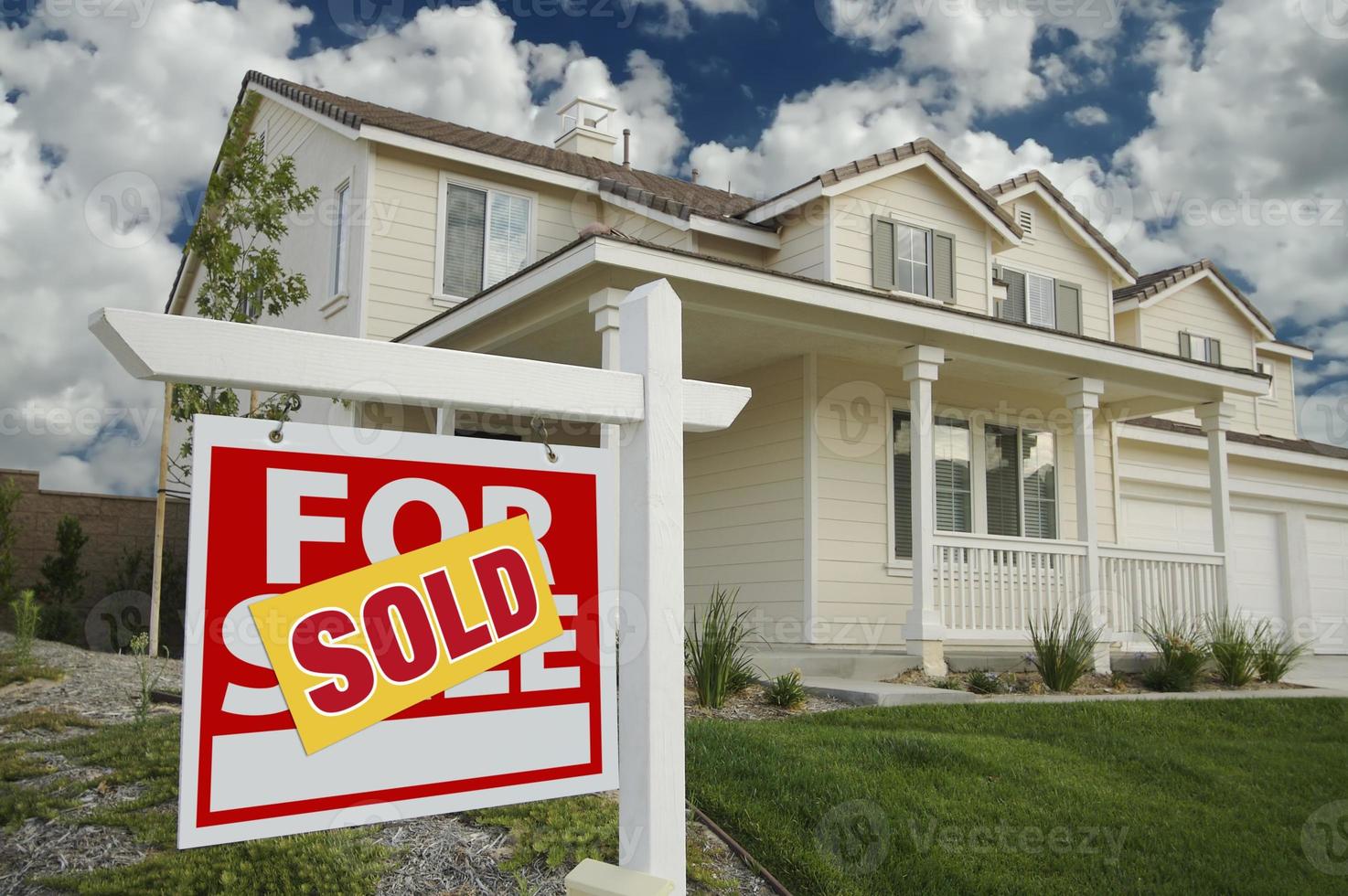 Sold Home For Sale Sign and House photo