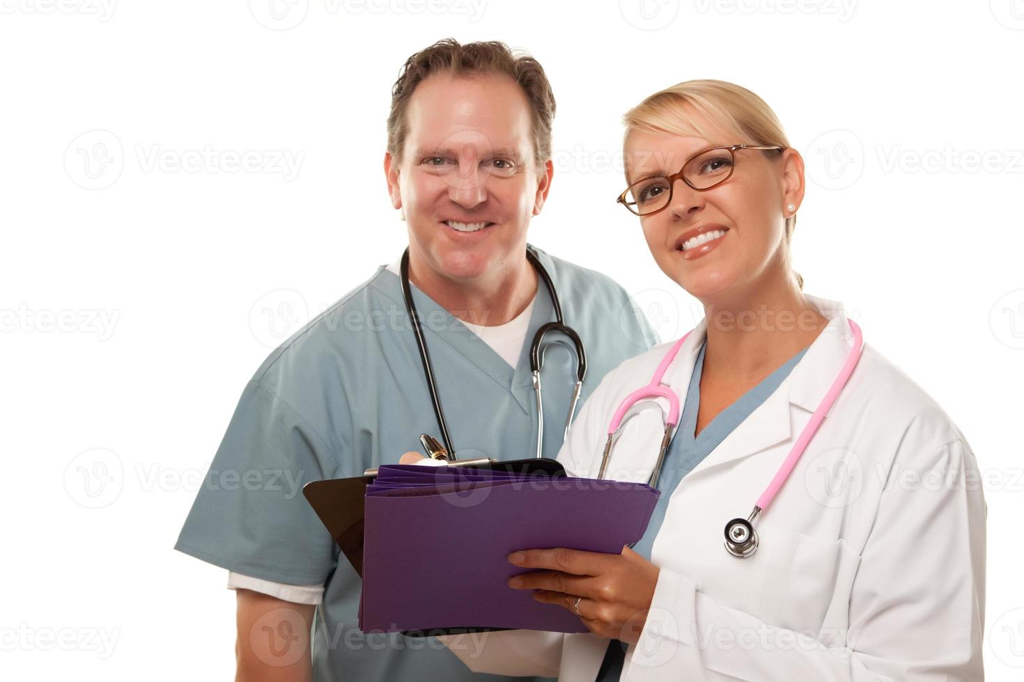 Male and Female Doctors Looking Over Files photo