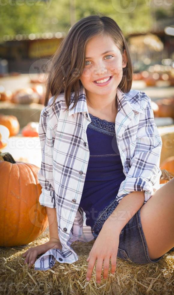 Preteen Girl Portrait at the Pumpkin Patch photo