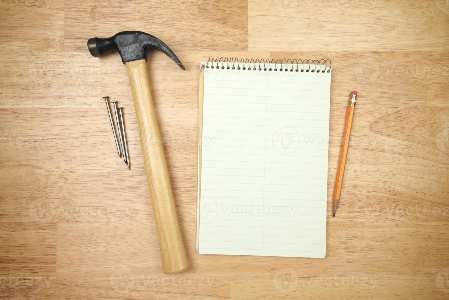 Pad of Paper, Pencil, Hammer and Nails photo