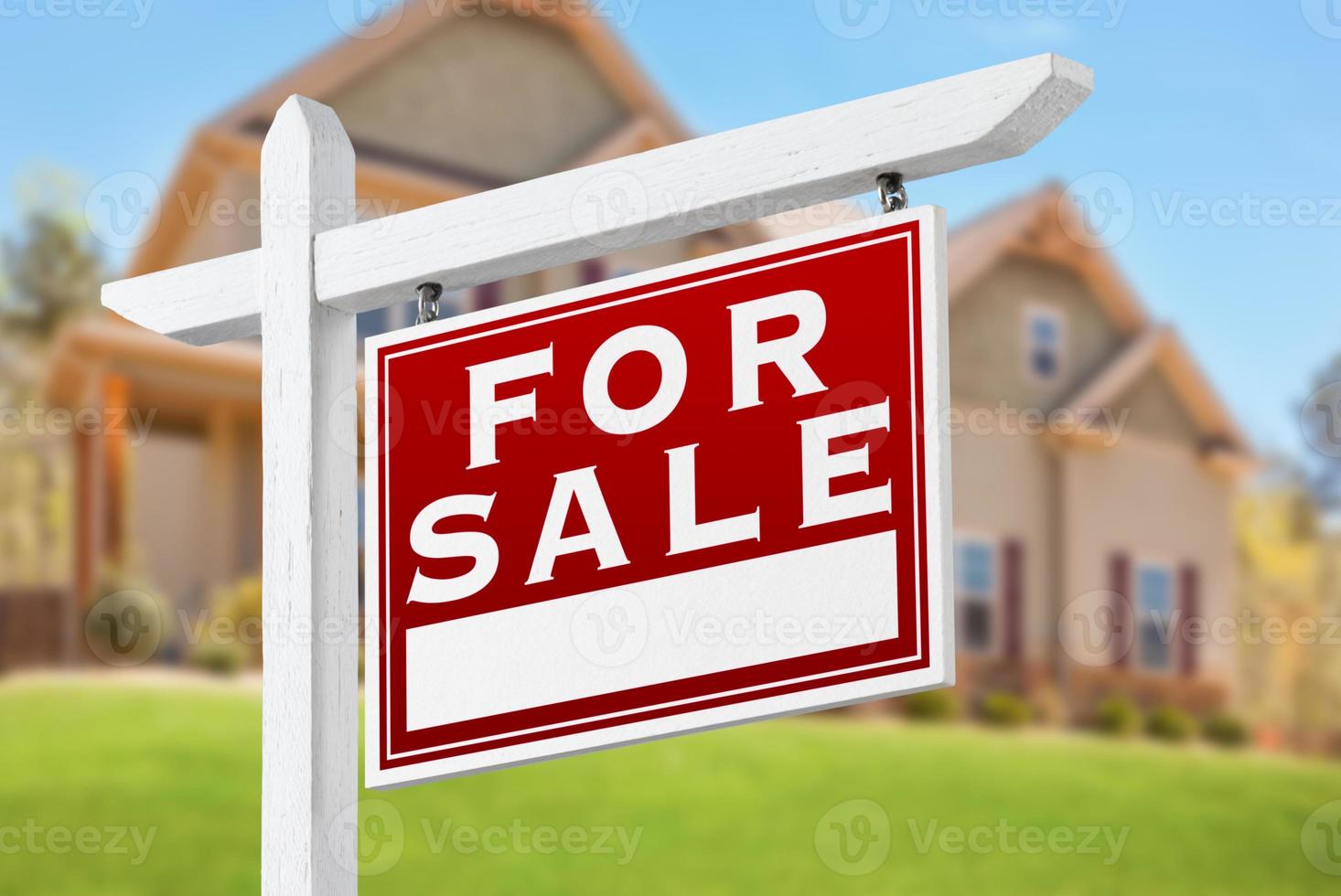 Home For Sale Real Estate Sign in Front of Beautiful New House photo