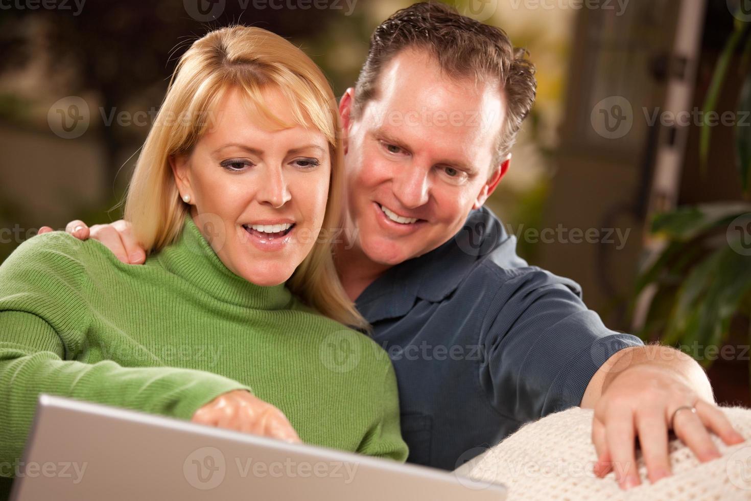 Handsome Couple Using Laptop photo