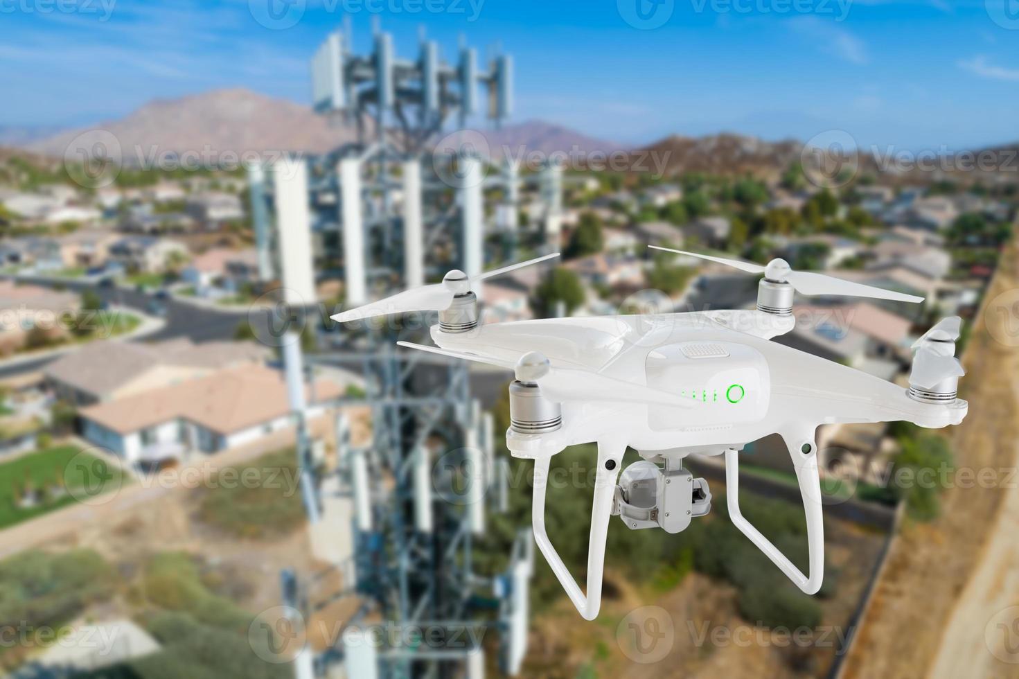 Unmanned Aircraft Drone Flying Near and Inspecting Cell Tower photo