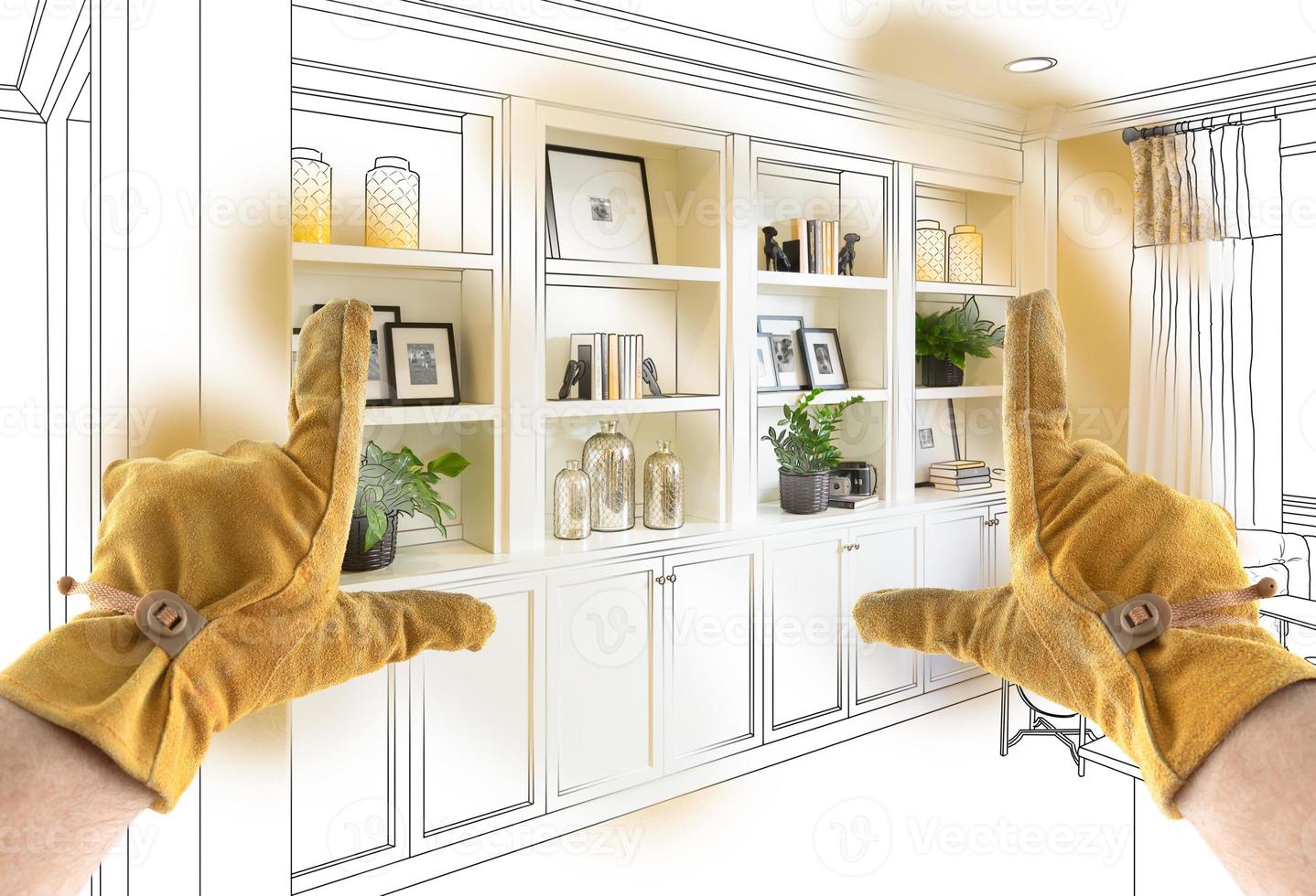Male Contractor Hands Framing Completed Section of Built In Shelving Over Drawing photo