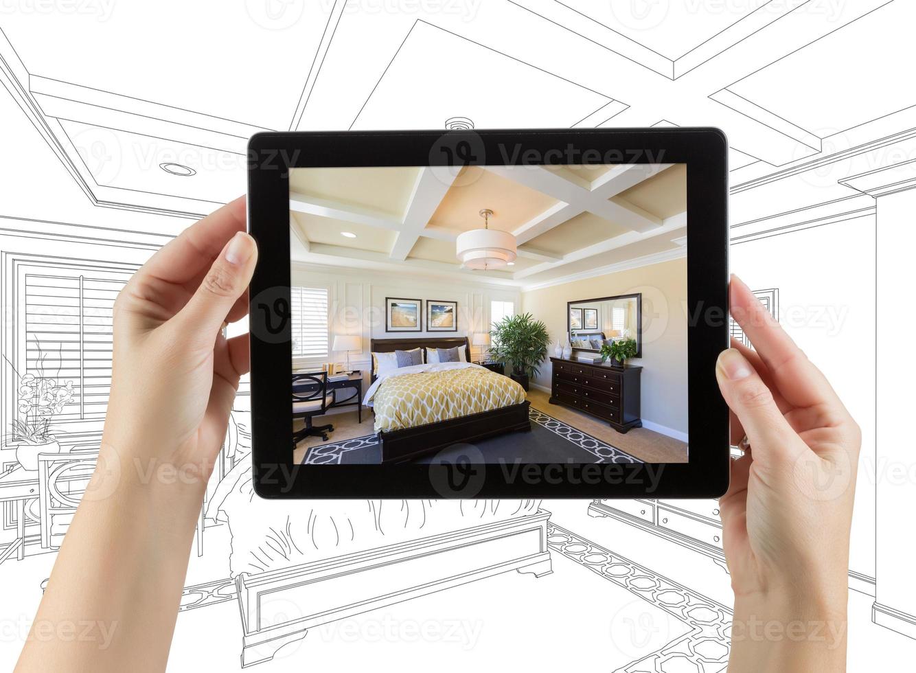 Female Hands Holding Computer Tablet with Bedroom Photo on Screen, Drawing Behind.