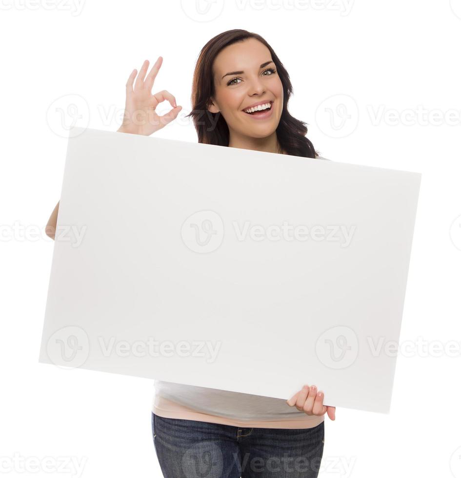 Smiling Mixed Race Female Holding Blank Sign on White photo