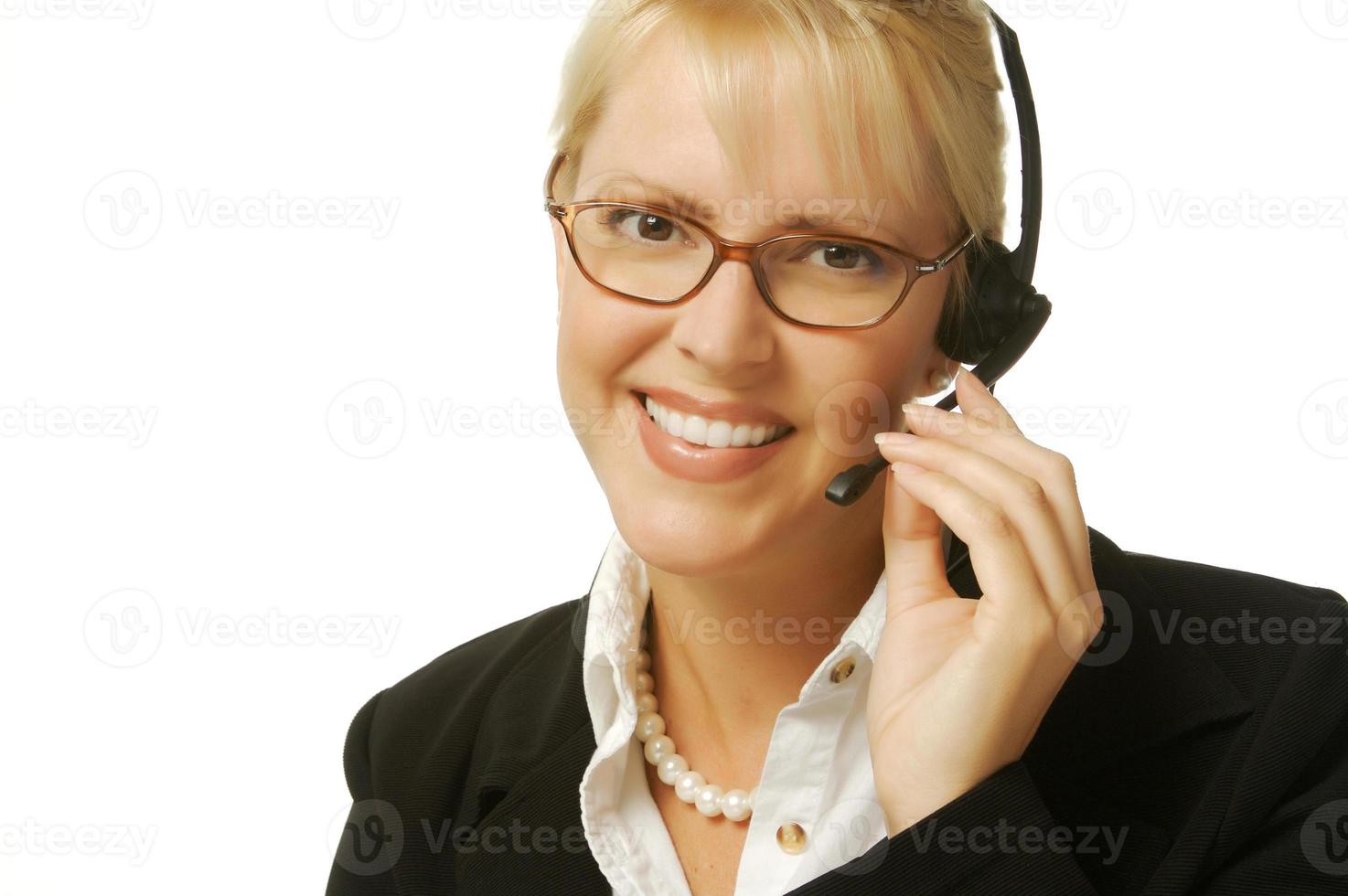 A beautiful friendly secretary telephone operator. photo