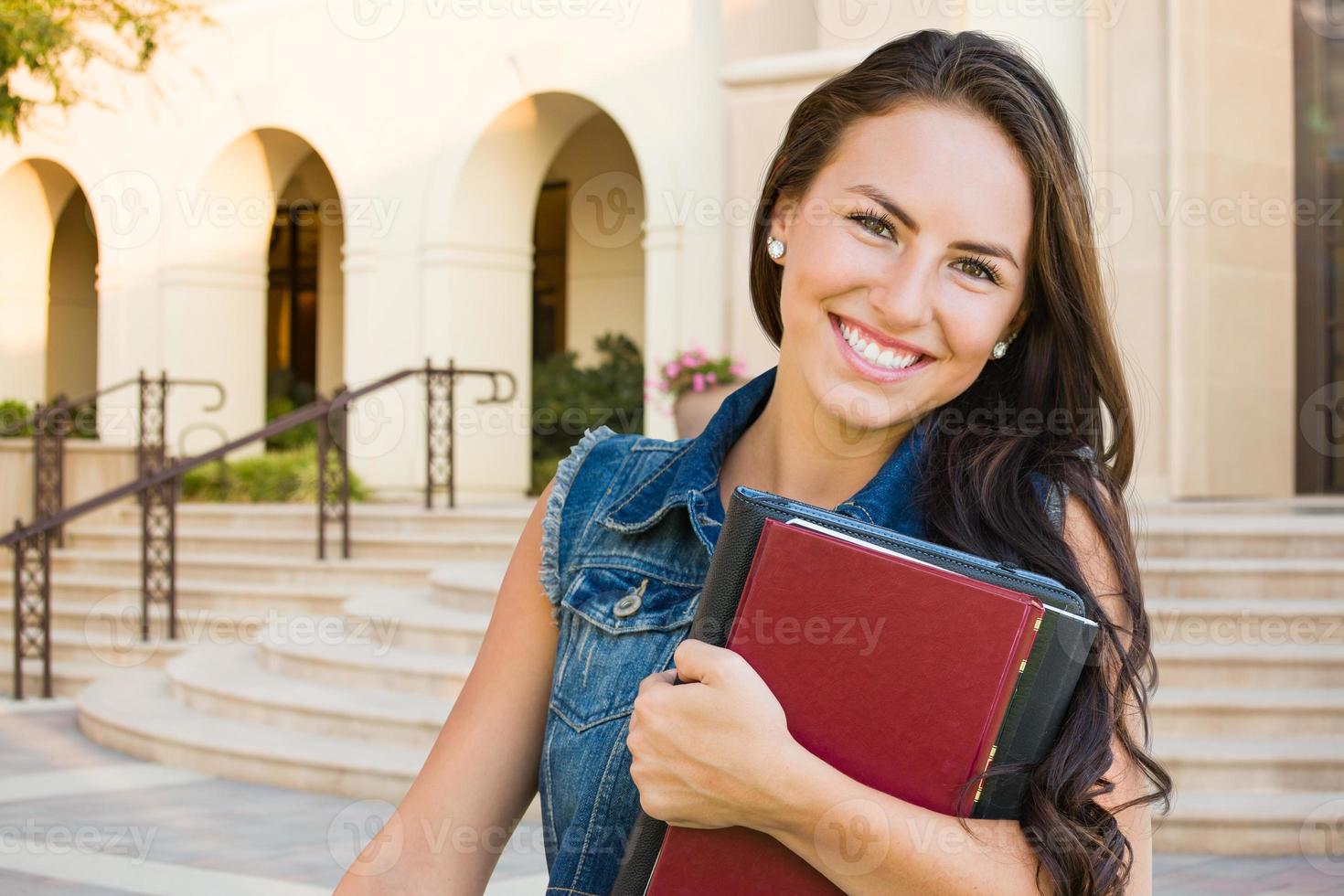 Mixed Race Young Girl Student with School Books On Campus photo