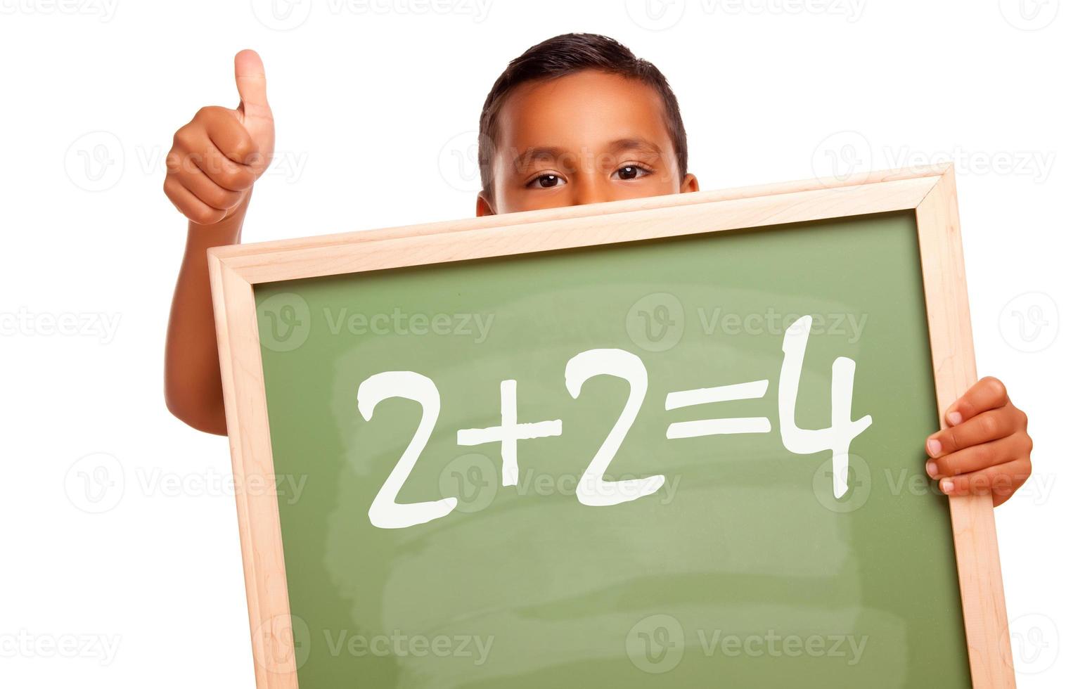 Proud Hispanic Boy Holding Chalkboard with Math Equation photo