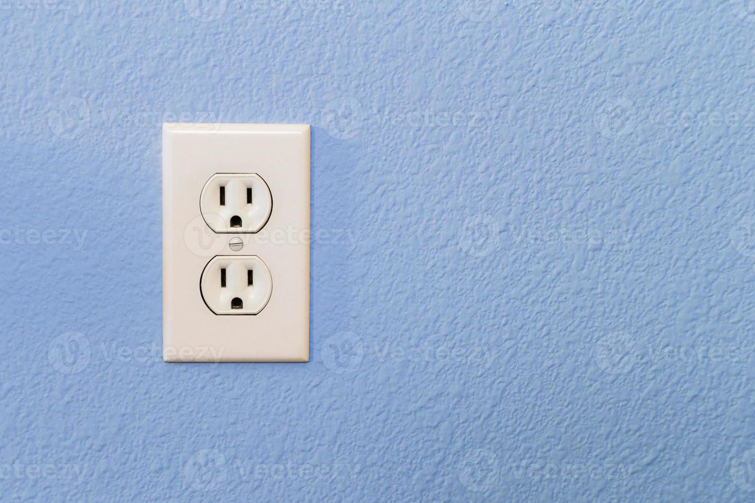 Electrical Sockets In Colorful Blue Wall photo