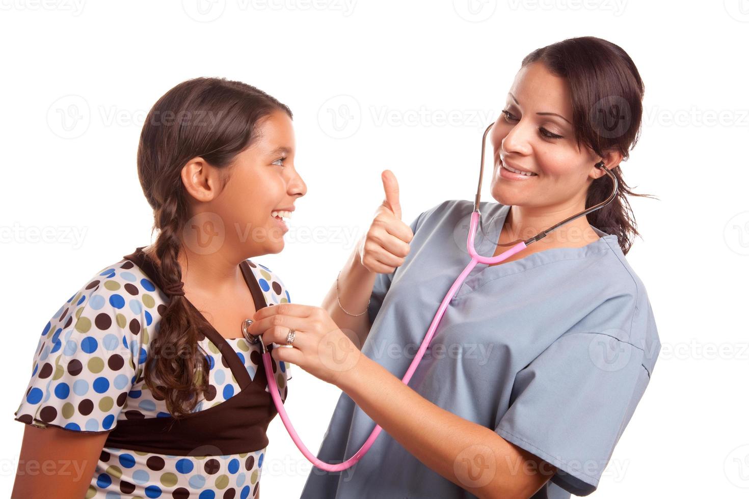 Pretty Hispanic Girl and Female Doctor Isolated photo