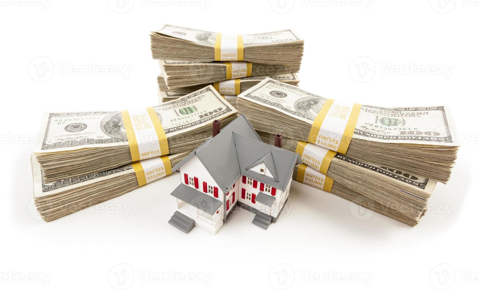 Stacks of Hundreds of Dollars with Small House photo