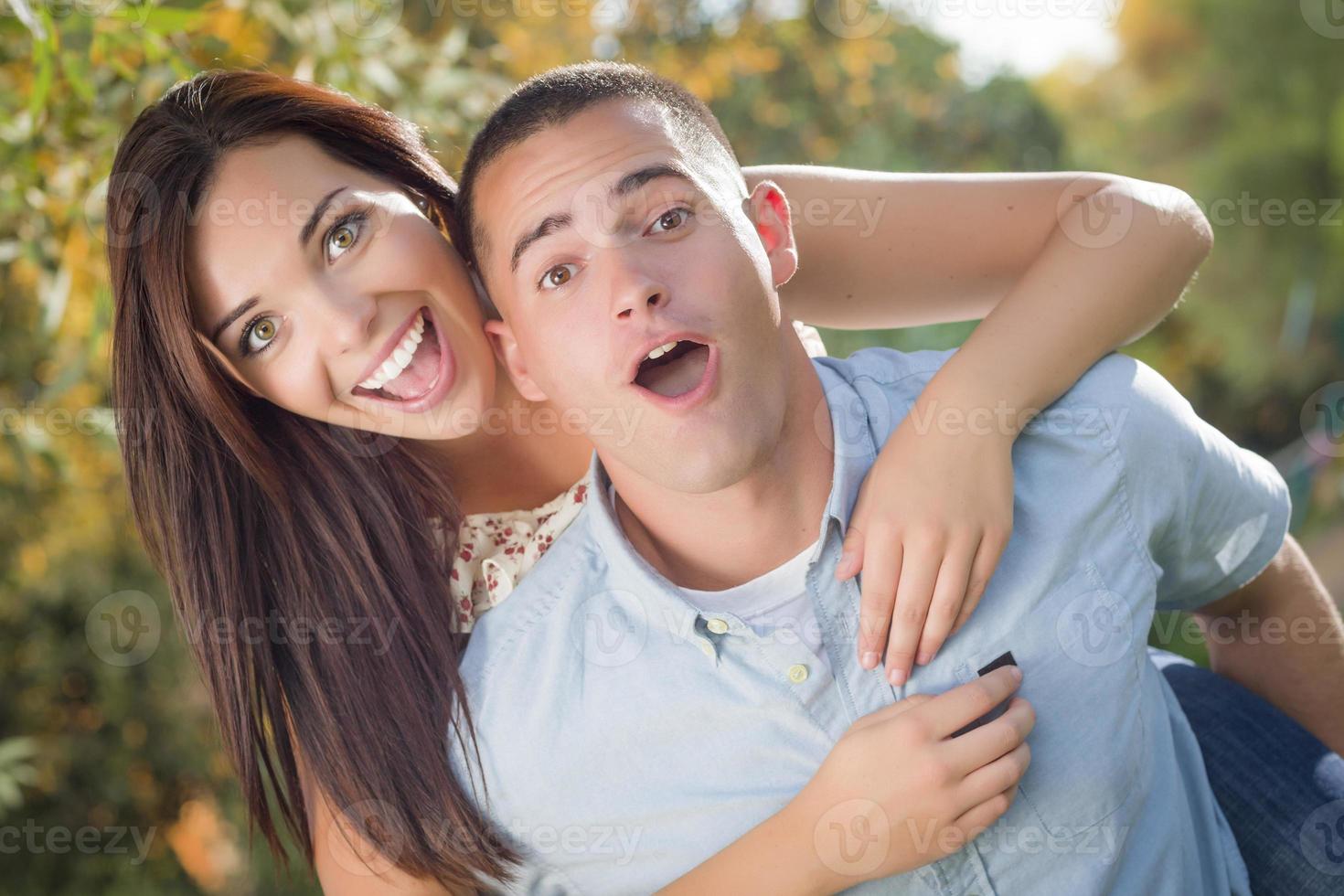Mixed Race Romantic Couple Portrait in the Park photo