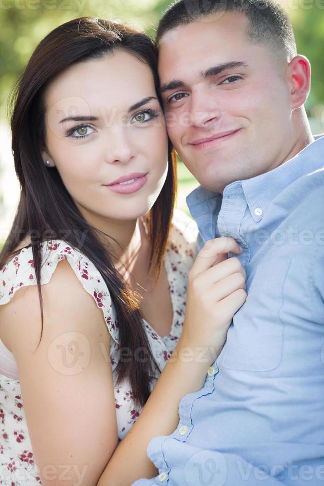 Mixed Race Romantic Couple Portrait in the Park photo