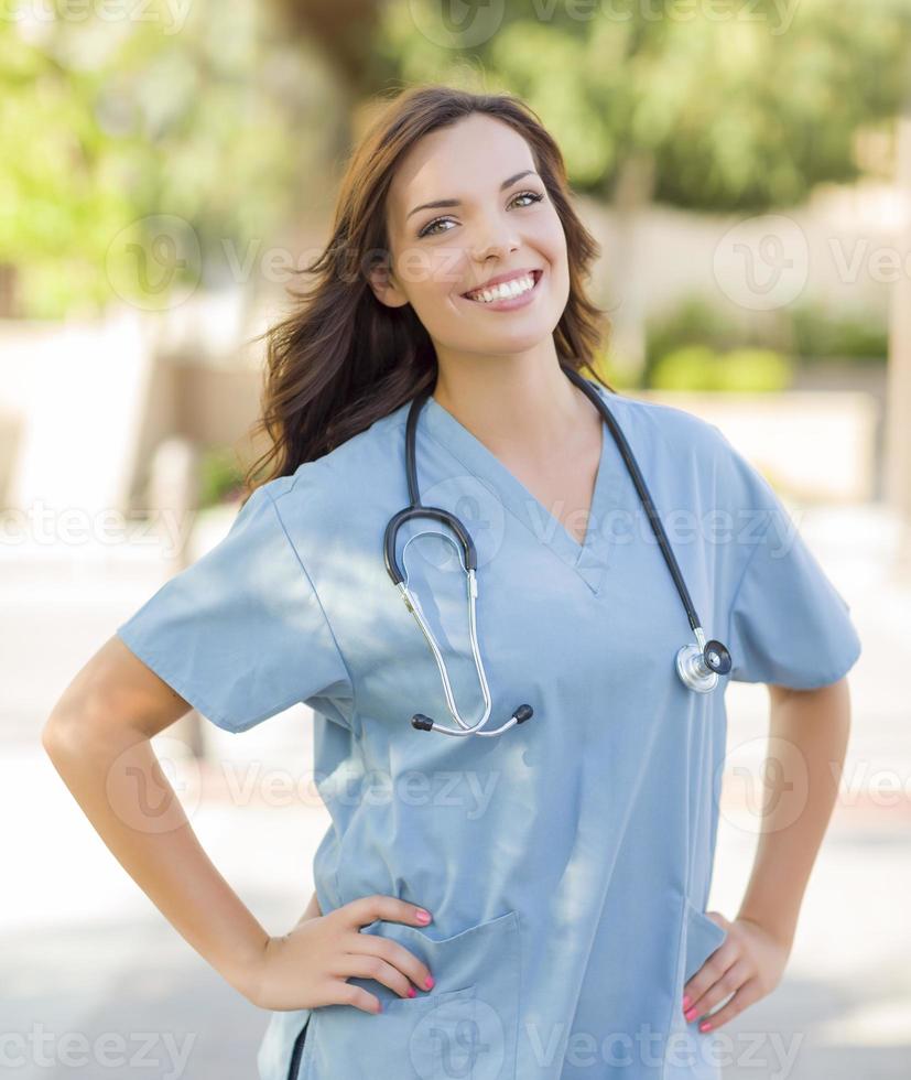 Proud Young Adult Woman Doctor or Nurse Portrait Outside photo