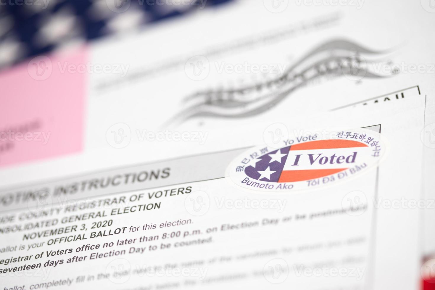 Vote-By-Mail Ballot Envelope and Voting Instructions Laying On American Flag photo