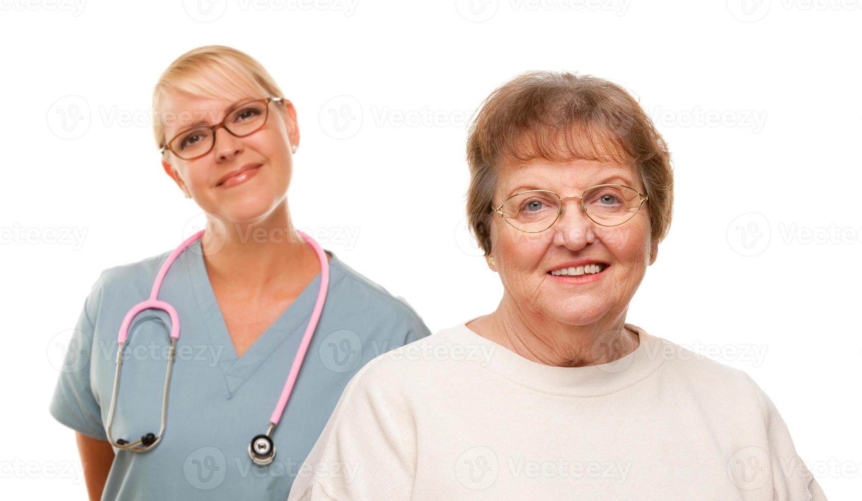 Smiling Senior Woman with Doctor Behind photo