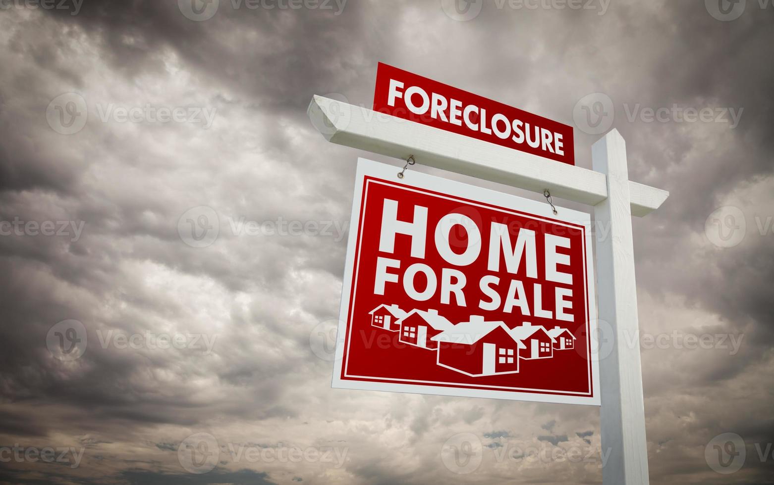 Red Foreclosure Home For Sale Real Estate Sign Over Cloudy Sky photo