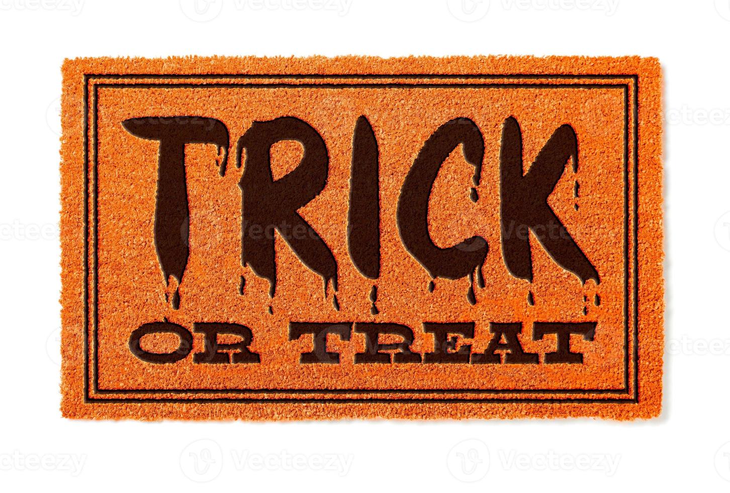 Trick Or Treat Halloween Orange Welcome Mat Isolated on White Background photo