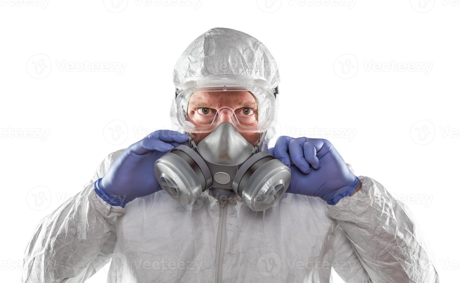 Man Wearing Hazmat Suit, Goggles and Gas Mask Isolated On White photo