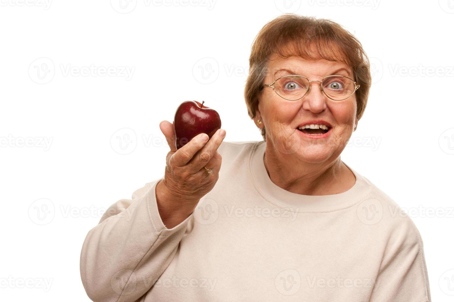 Attractive Senior Woman with Red Apple photo