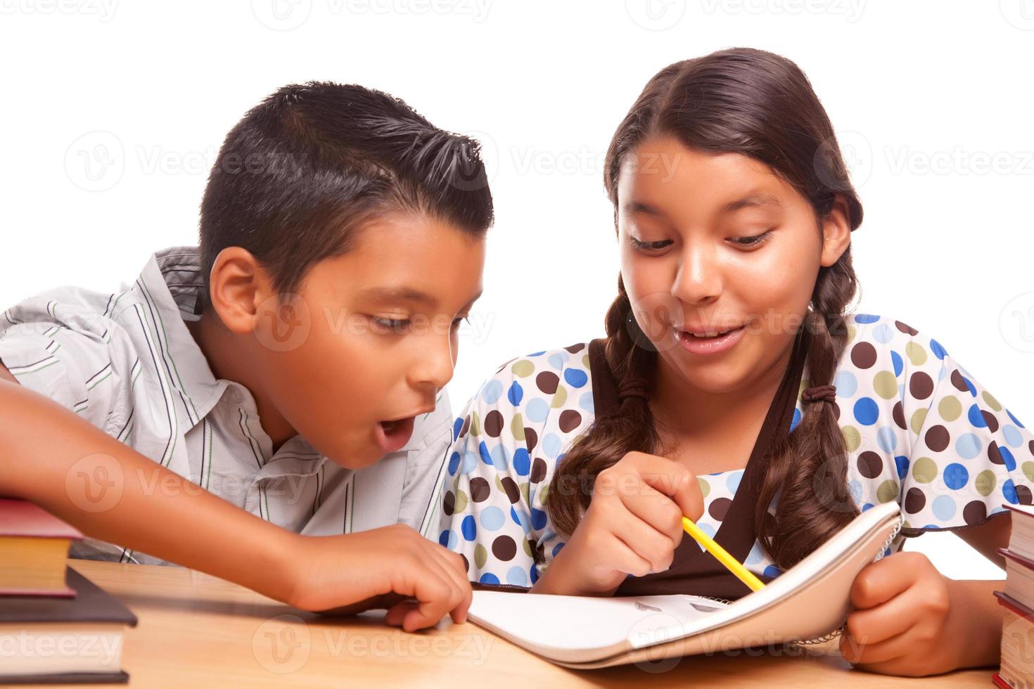 Hispanic Brother and Sister Having Fun Studying photo