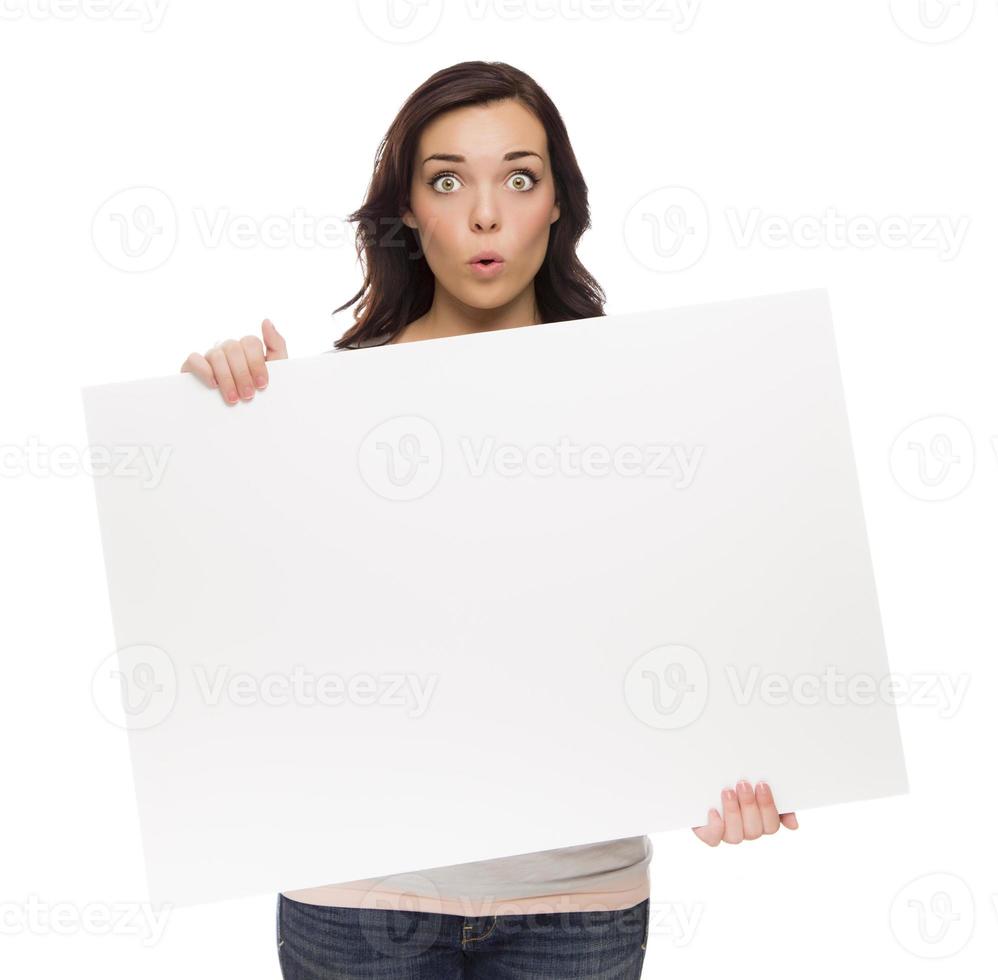 Wide Eyed Mixed Race Female Holding Blank Sign on White photo