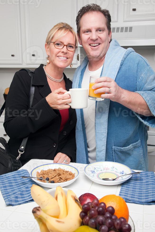 Businesswoman with Husband In Kitchen photo