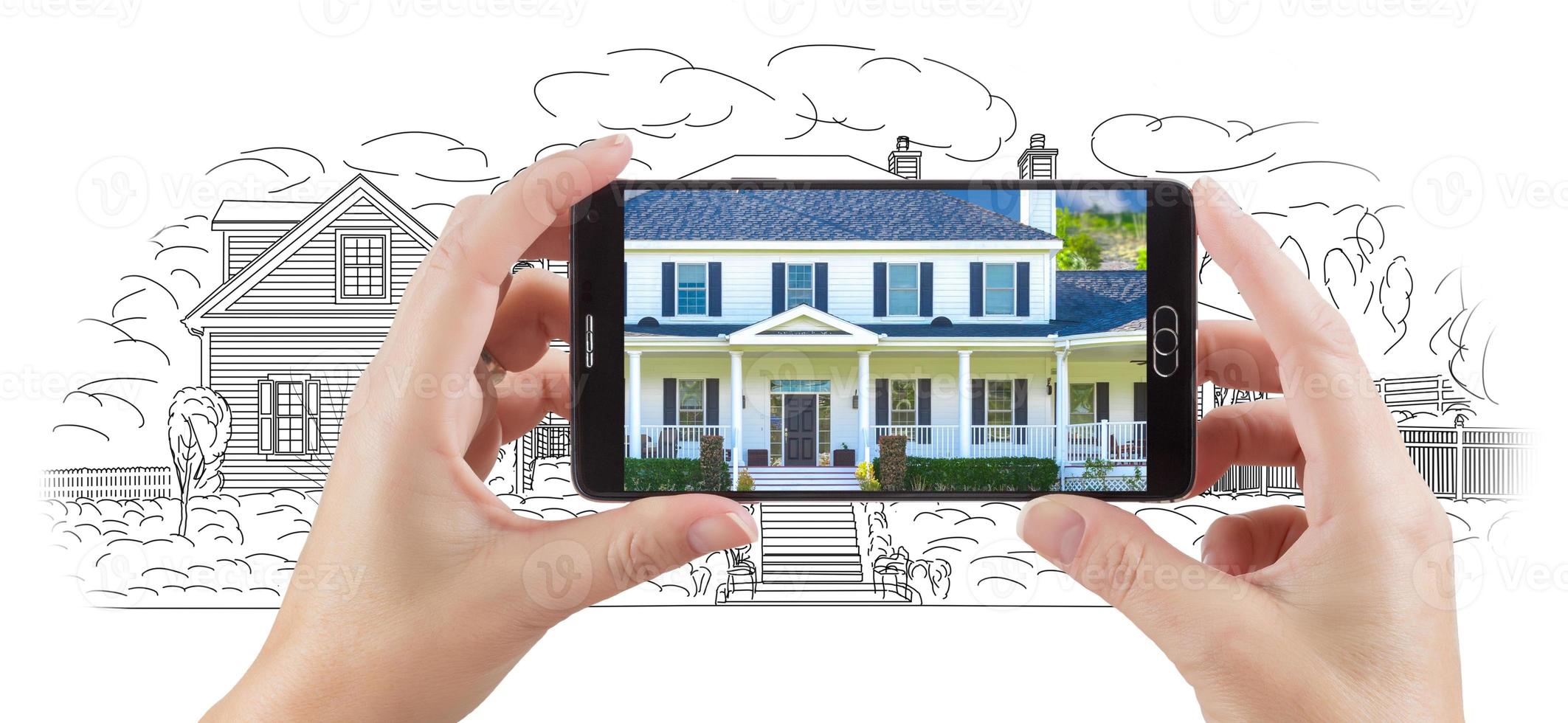 Hands Holding Smart Phone Displaying Home Photo of Drawing Behind
