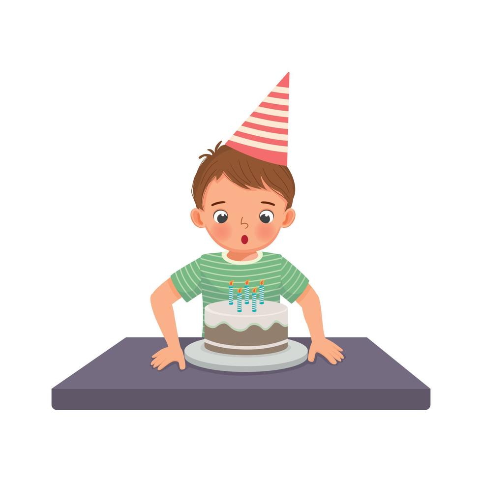 happy little boy blowing candles celebrating his birthday party vector