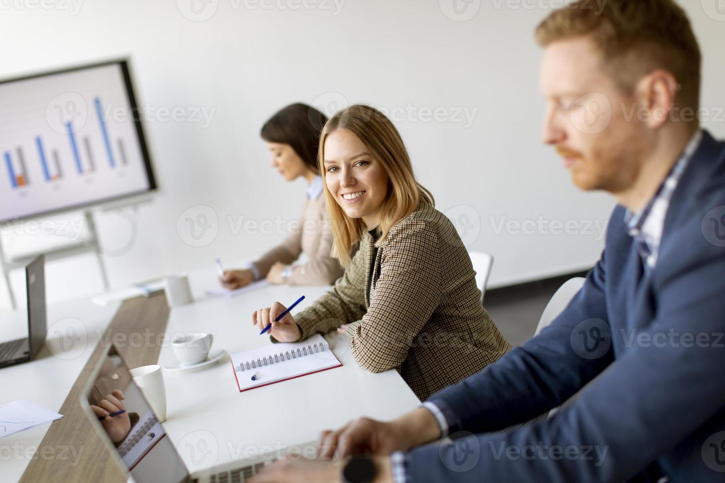 Group of multiethnic business people working together and preparing new project on a meeting in office photo