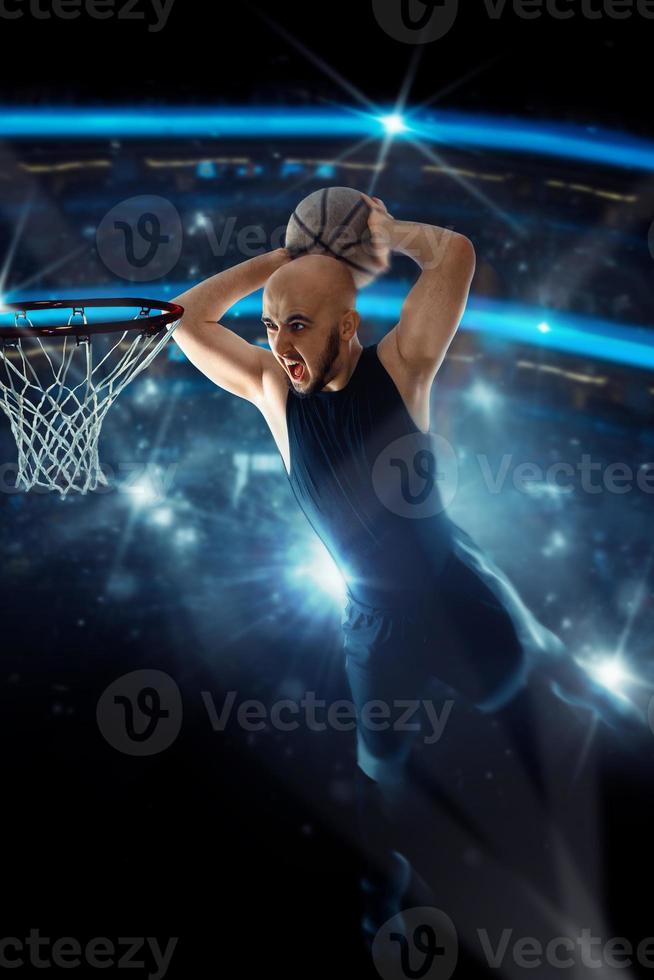 Basketball player in black jersey makes a slam dunk in the game photo