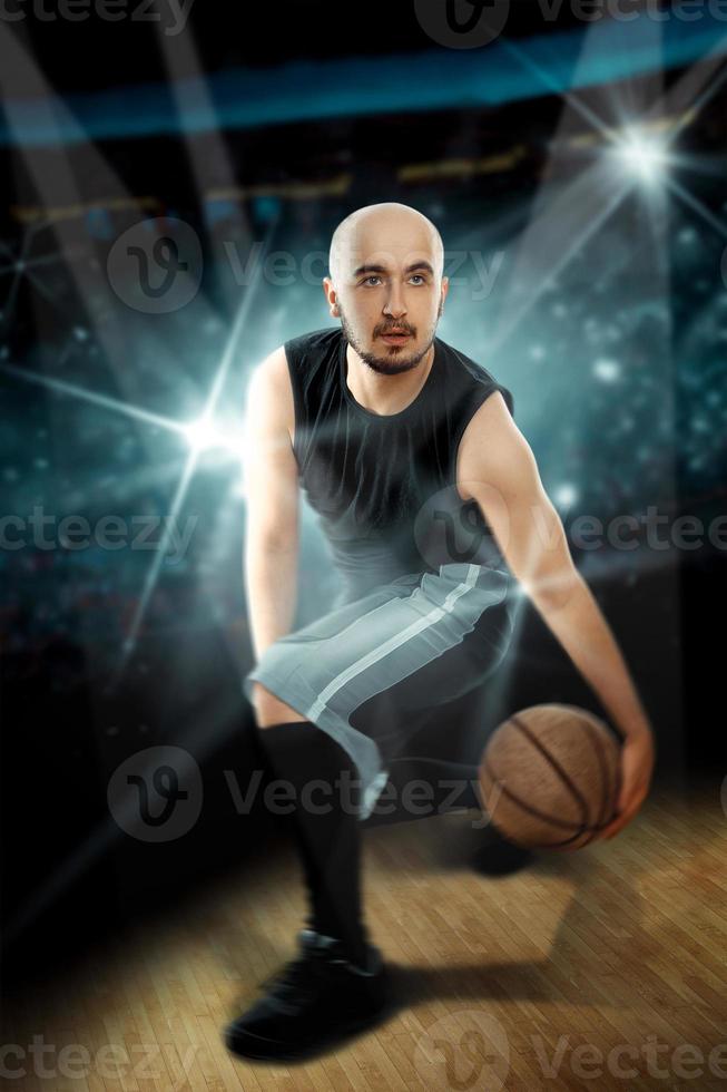 professional basketball player in the game making feints with the ball photo