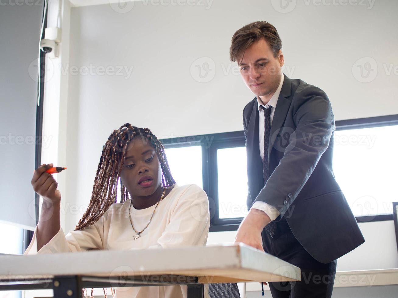 Office company room businessman manager boss person pointing finger cheerful teach businesswoman person black african skin employee meeting partner corporate indoor classroom strategy vision idea photo