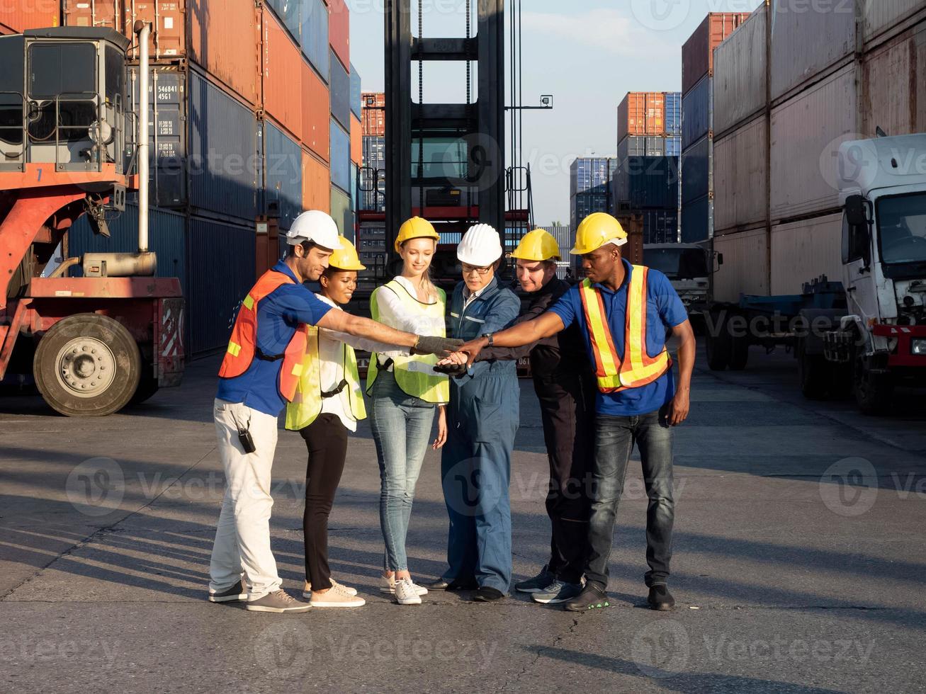 businessman male supervisor manager touch hand businesswoman female white yellow hardhat helmet safety labor employee import export container industry constration project site group teamwork together photo