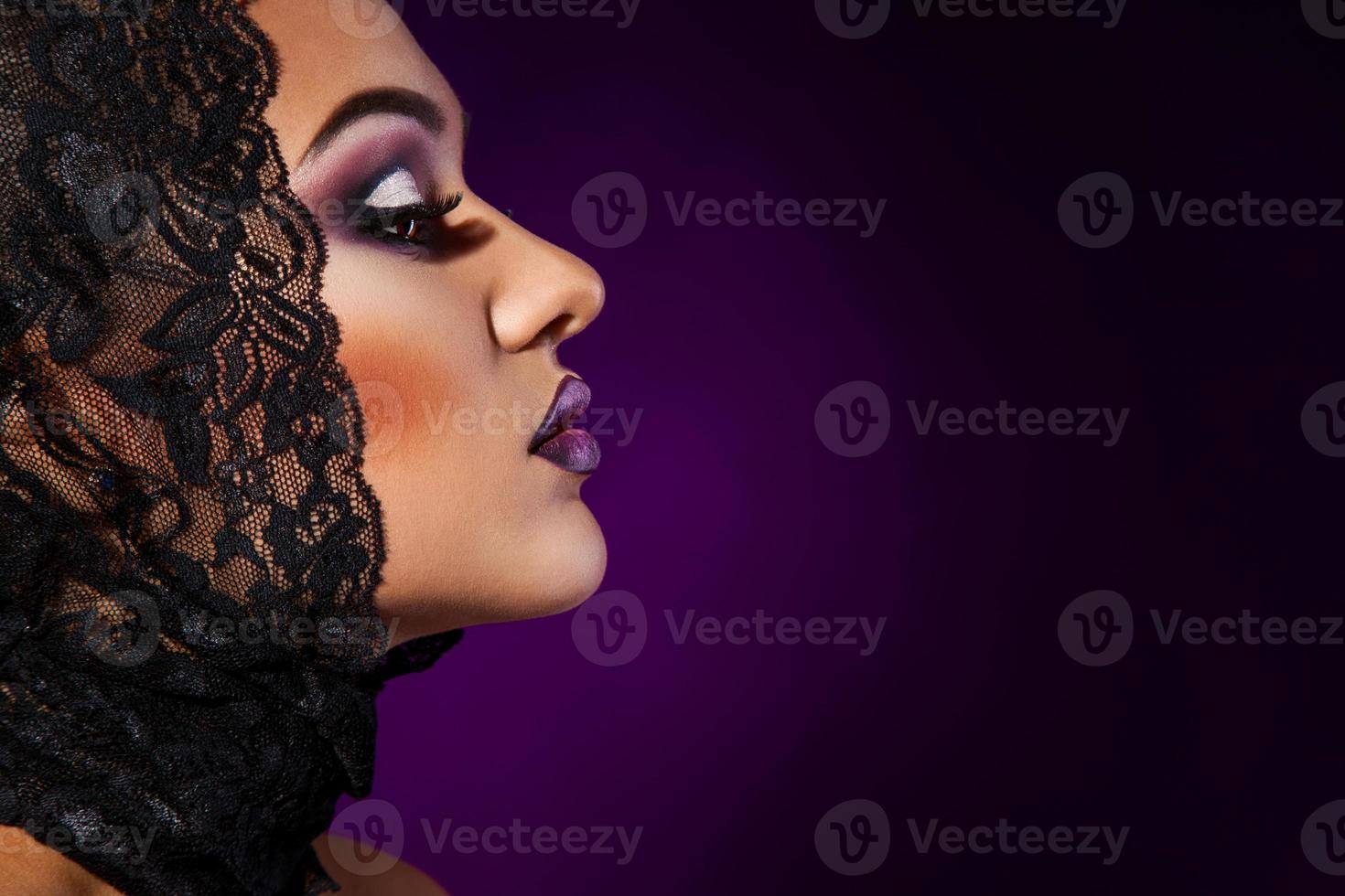Photo of sensual woman on purple background
