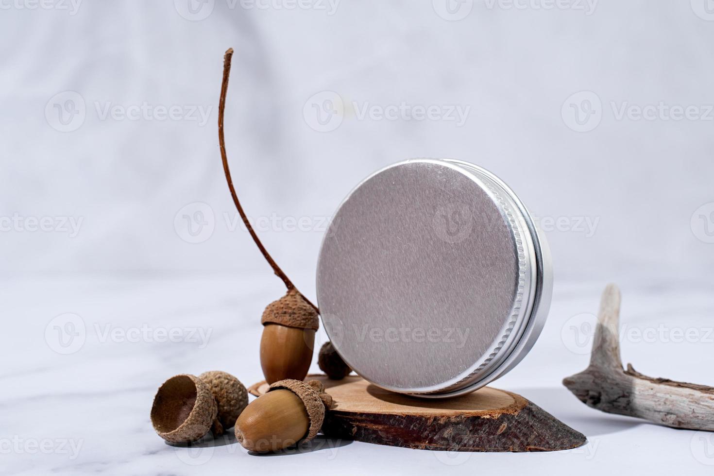 colorful lip balms in round tin cases on podium with shadow overlay, mockup design photo