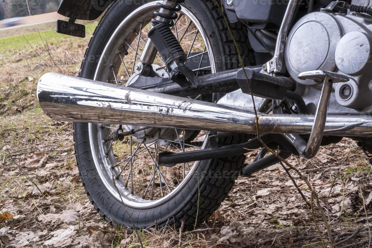 motorcycle rear wheel and exhaust pipe photo
