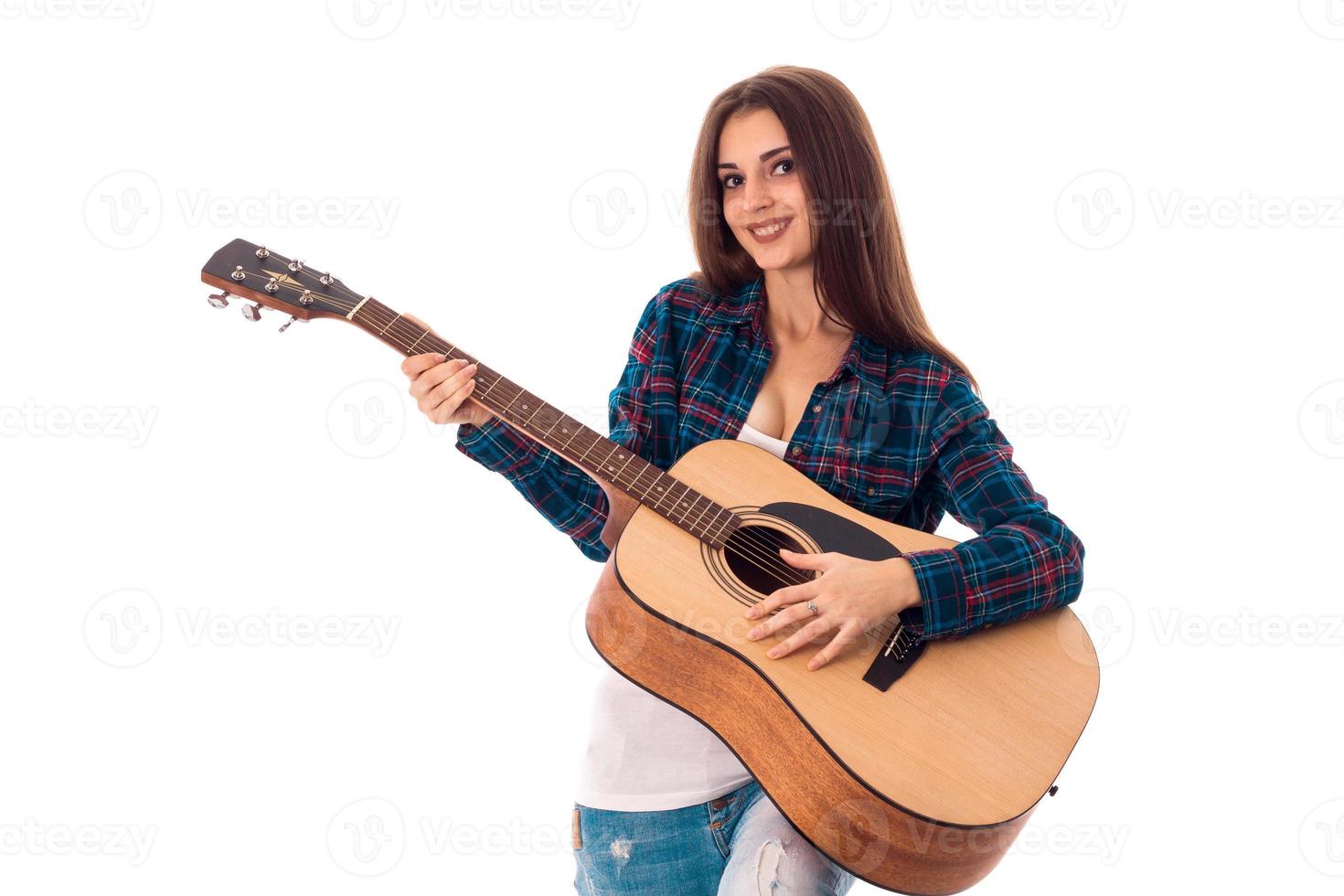 cheerful Brunette woman playing guitar photo