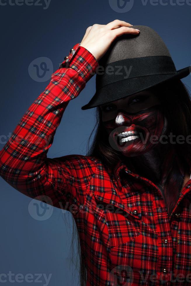 Studio photo of adult woman with scary make up for halloween