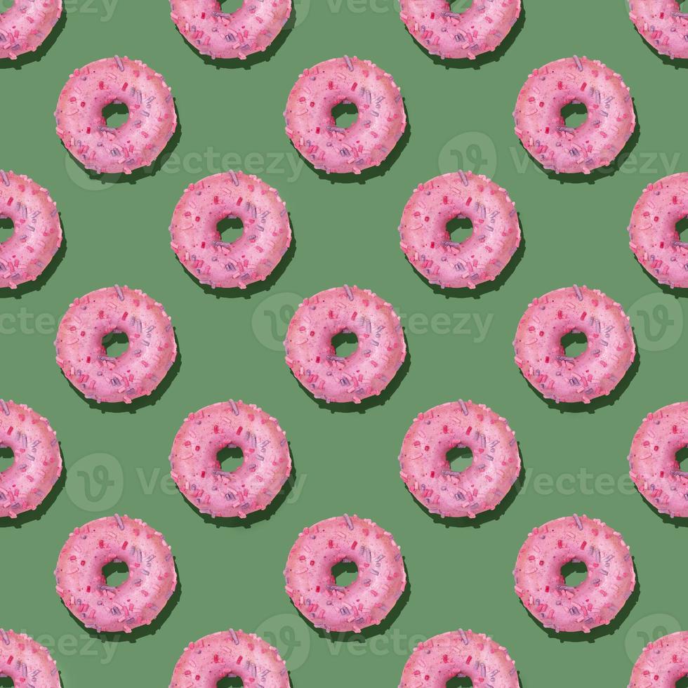 Trendy square seamless pattern of traditional doughnuts with lilac glaze on calm green background. Hard shadows. photo