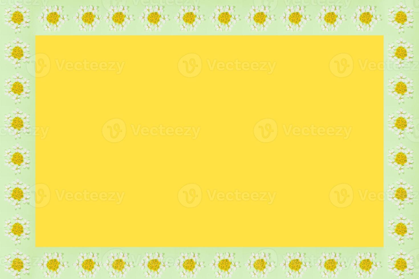 Rectangular green frame with recurring patterns in form flower on trendy yellow Illumination background. photo